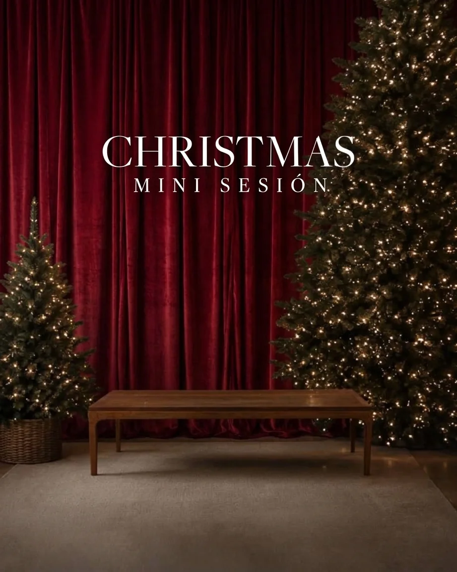 Christmas Mini Session backdrop with red velvet curtain and lit trees